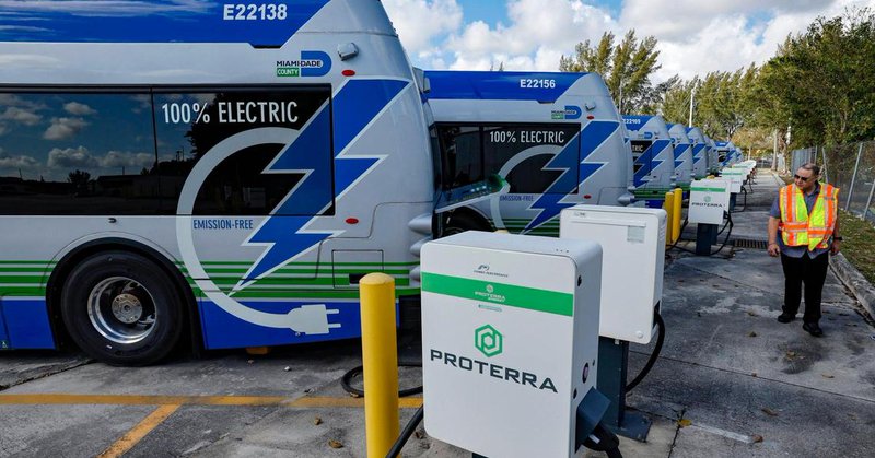 Lazaro Dominguez, with the Department of Transportation and Public Works, walks past a row of broken electric Proterra buses parked at Miami-Dade County Coral Way Bus Maintenance Facility in Miami on Wednesday, February 19, 2025. The majority of Miami-Dade’s electric buses haven’t been serviced since the bus company, Proterra, filed for bankruptcy.