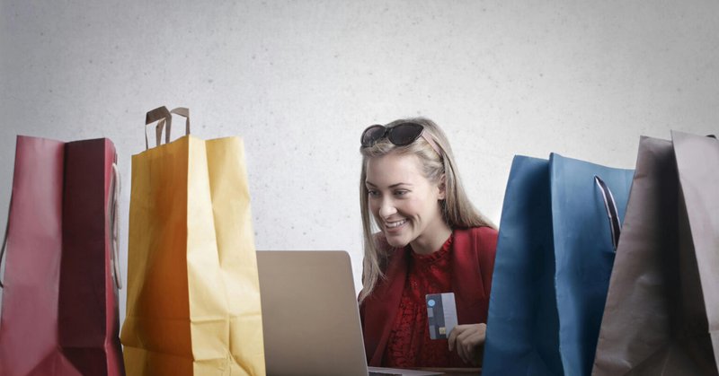A woman shopping with a collection of shopping bags