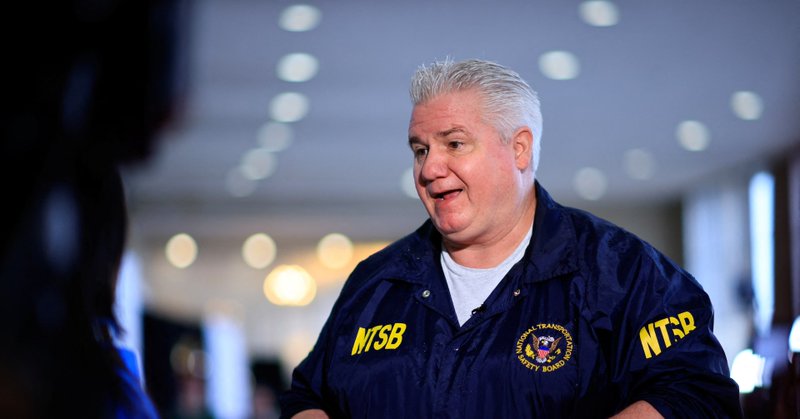 Member of the National Transportation Safety Board (NTSB) ​​​J. Todd Inman speaks with a journalist, in the aftermath of the collision of American Eagle flight 5342 and a Black Hawk helicopter that crashed into the Potomac River, at Ronald Reagan Washington National Airport, in Arlington, Virginia, U.S., January 31, 2025. REUTERS/Eduardo Munoz