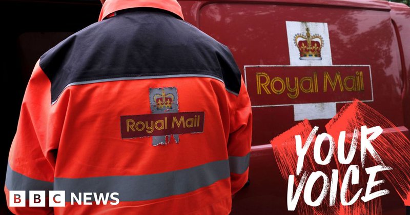 An employee of Royal Mail sorts parcels and letters in the back of his delivery van. The Royal Mail branding is on the back of his jacket and on the side of the van.