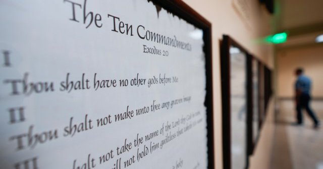 FILE - A copy of the Ten Commandments is posted along with other historical documents in a hallway of the Georgia Capitol, June 20, 2024, in Atlanta. (AP Photo/John Bazemore, File)
