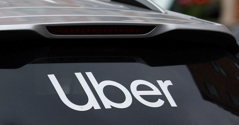 The Uber logo is seen on the rear window of a taxi, in Dublin, Ireland, June 29, 2025. REUTERS/Clodagh Kilcoyne