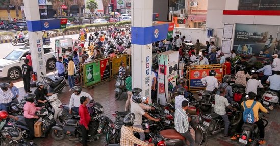 People queue up at a petrol pump amid rumours of fuel shortage in the wake of the West Asian conflict, in Prayagraj, Uttar Pradesh, Thursday, March 26, 2026.