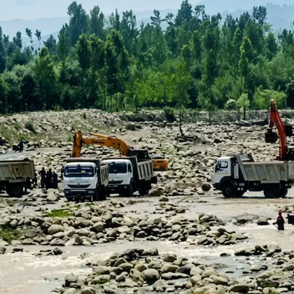 A July 2024 photograph showing the use of heavy machinery in riverbed mining in the Sukhnag rivulet.