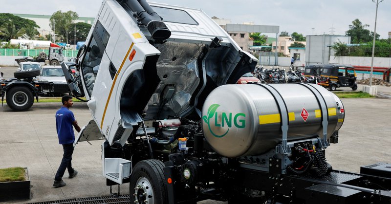A man opens the hood of a Blue Energy 5528 liquefied natural gas (LNG) truck to check the engine at the manufacturing facility in Pune, India, October 11, 2024. REUTERS/Francis Mascarenhas/File Photo