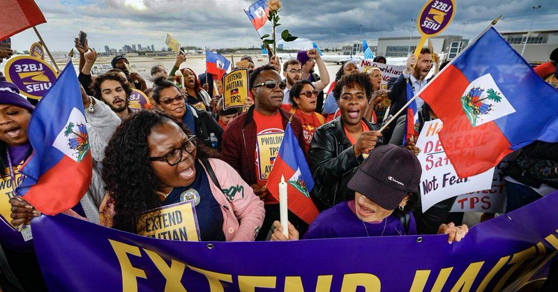 Protestors gather during a candlelight vigil, and interfaith prayer at Fort Lauderdale–Hollywood International Airport as airport workers and faith leaders rally calling on the Trump Administration to extend Temporary Protected Status (TPS) for Haiti on Wednesday, January 28, 2026.