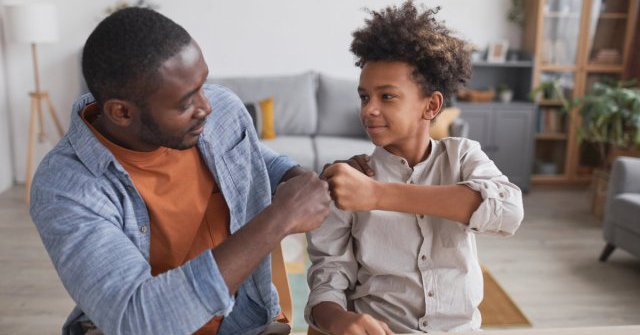Father and son celebrate a mental math answer