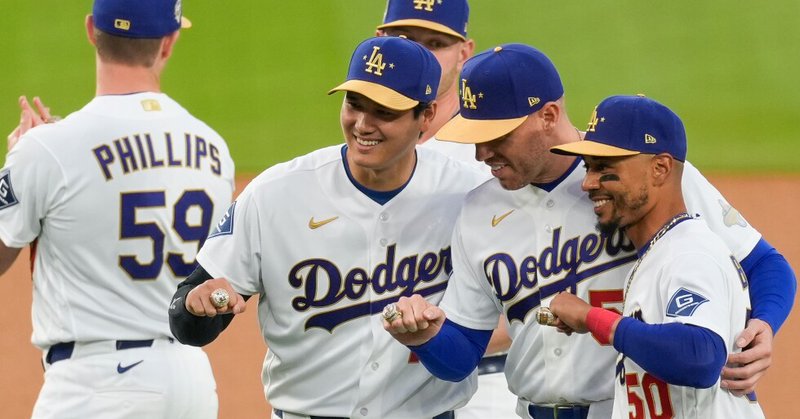 Los Angeles Dodgers Shohei Ohtani, Freddie Freeman and Mookie Betts pose with their rings during a World Series Champion ring ceremony prior to a baseball game against the Arizona Diamondbacks in Los Angeles, Friday, March 27, 2026. (AP Photo/Caroline Brehman)