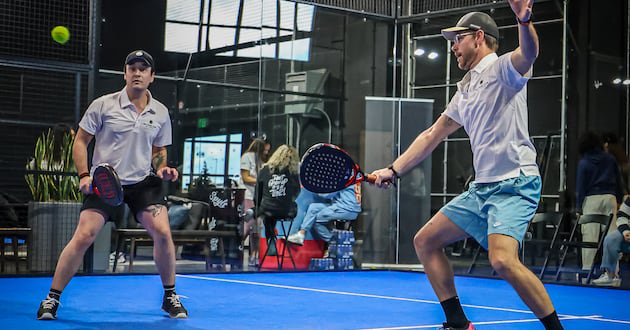 Players compete on one of Salt Lake City Padel Club’s indoor courts.