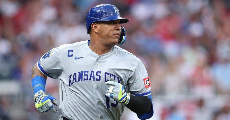 Kansas City Royals catcher Salvador Perez hits a single against the Atlanta Braves during the second inning of the home opener at Truist Park on March 27, 2026 in Atlanta, Georgia.