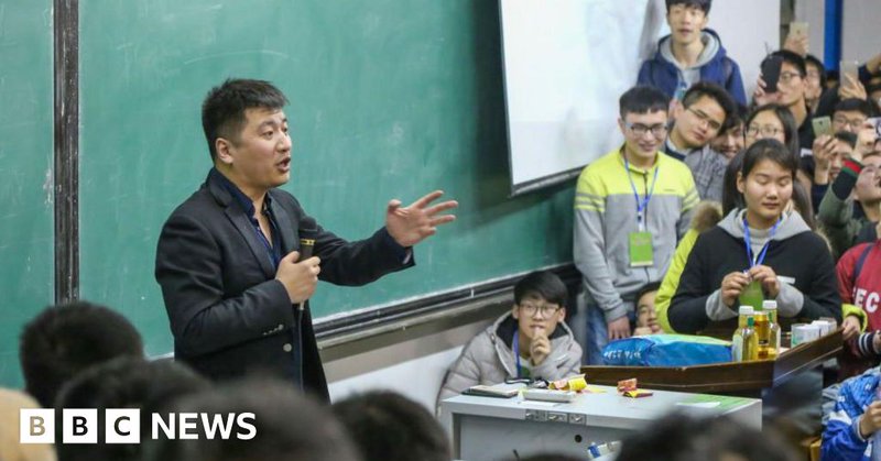 Students listen to a lecture by education influencer Zhang Xuefeng visiting Henan University of Technology in Zhengzhou in central China's Henan province