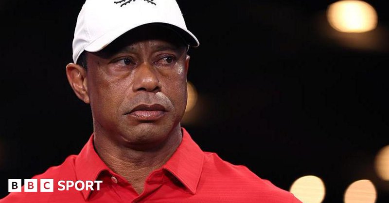 Tiger Woods in a red shirt and white cap