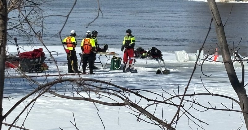 Members of the Montreal police (SPVM) Marine Unit search the Rivière des Prairies on Saturday, March 28, 2026, after a man fell through the ice. (Kelly Greig/CTV News)