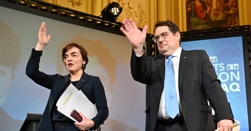 CAQ leadership candidates Christine Frechette, on the left, and Bernard Drainville wave to the crowd following a debate on the leadership of the Coalition Avenir Québec in Québec City on Saturday, March 21, 2026. (The Canadian Press/Jacques Boissinot)