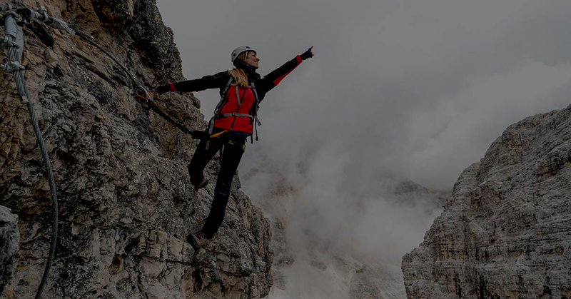 Woman mountain climber symbolizing scalable multi-entity accounting business growth
