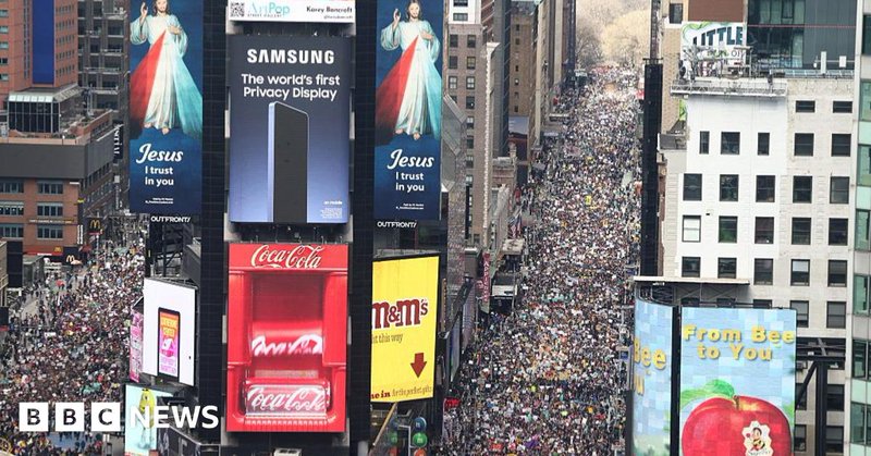 A sea of protestors take the streets in New York City through Times Square.