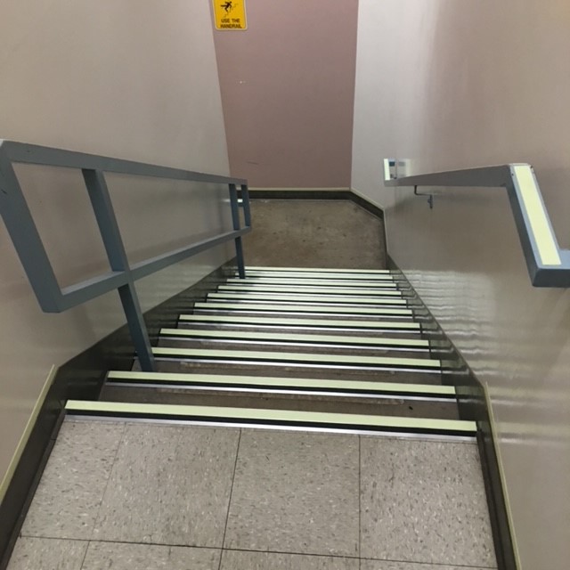IFC-compliant luminous stairwell markings in high-rise building. Designed and installed by Luminous Egress.
