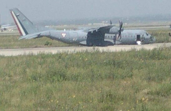 The aircraft, operated by Escuadrón Aéreo 301, was returning shortly after takeoff when it touched down on runway 04R without its landing gear fully deployed. All three crew members on board escaped unharmed, but the aircraft sustained substantial damage and was destroyed. The incident occurred under clear skies with light winds, and the plane had departed and was scheduled to land at the same airport. This photo shows the aircraft on the tarmac post-incident. 