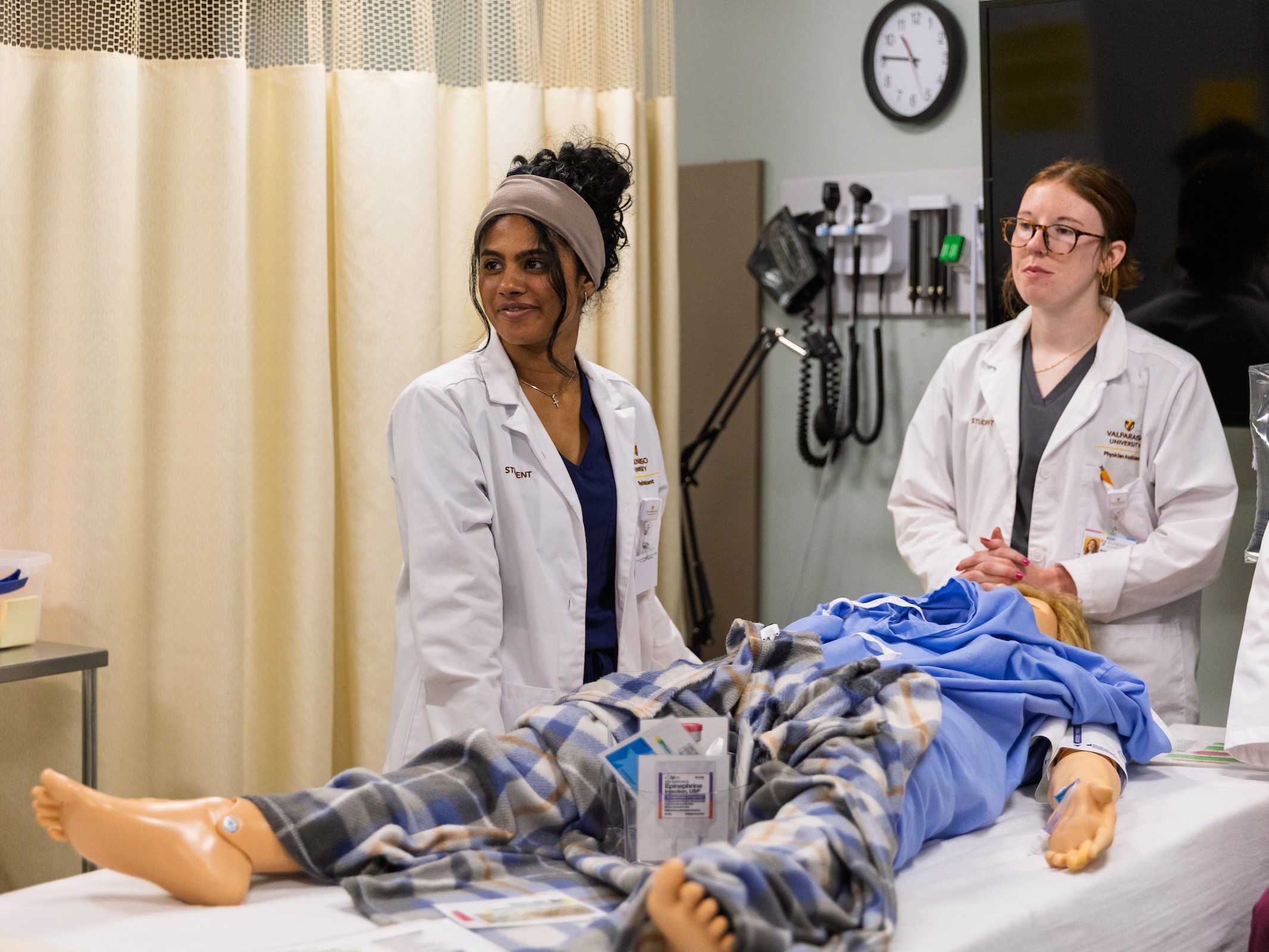 Two Valparaiso University master of science in physician assistant studies students in a lab.