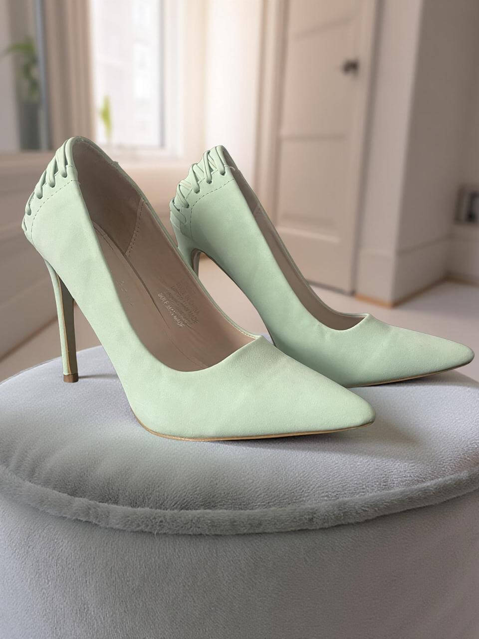 Sissy Boy Heels angled view showing light lime green colour with pointed toes and layered stitched detailing at the back. 
https://www.theshoppingcart.co.za/product-page/sissy-boy-heels