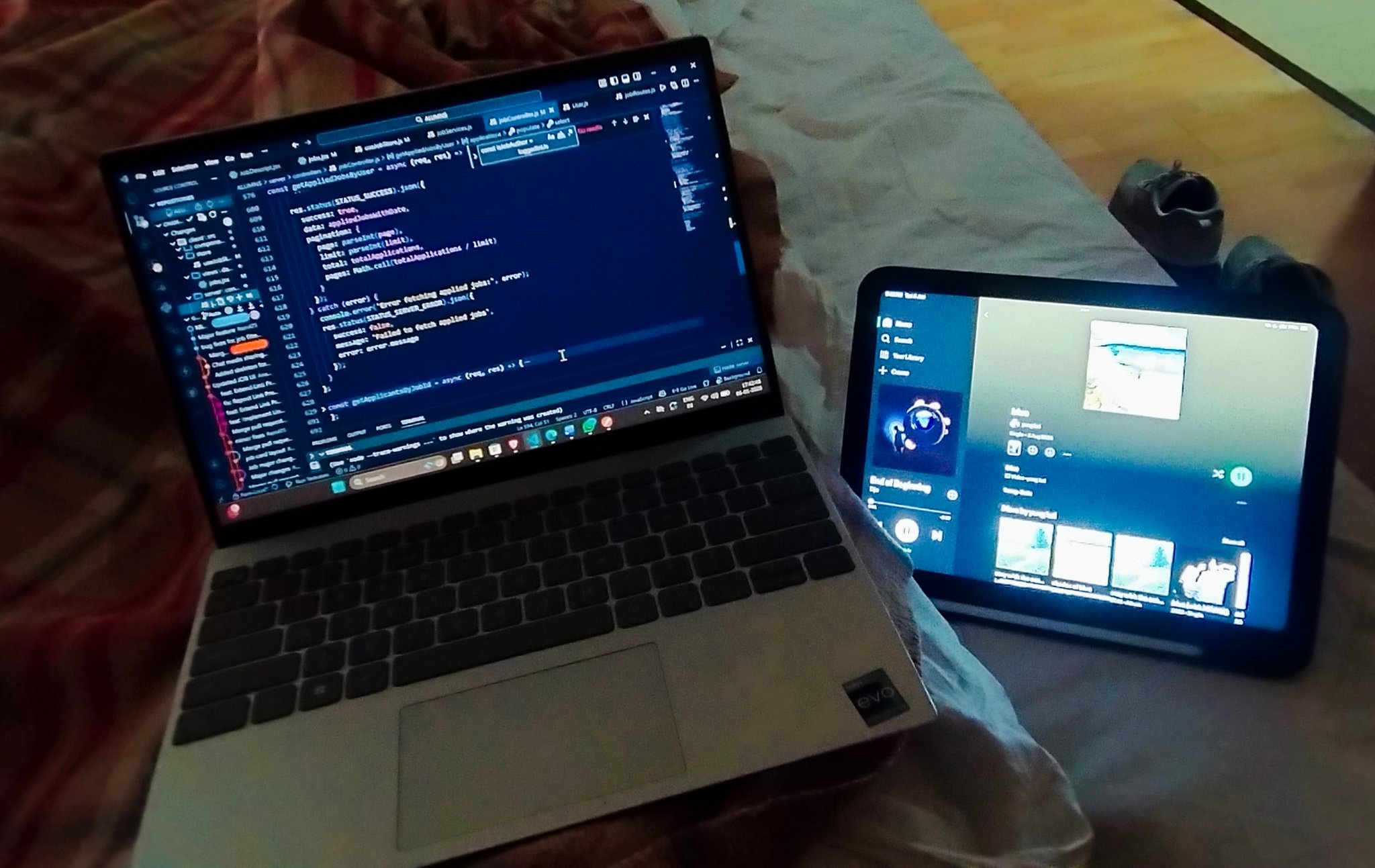 Laptop coding on bed while travelling