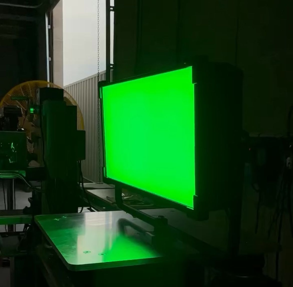 Cineo Quantum Studio LED light illuminated in green