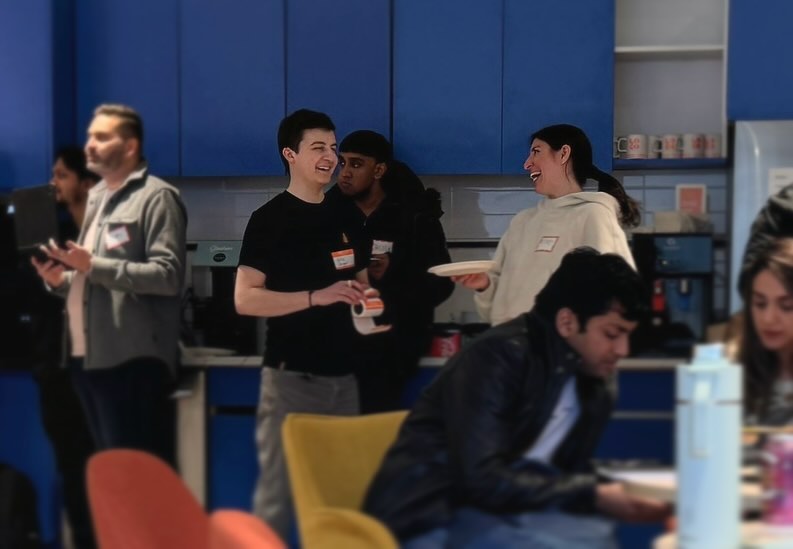 Eric and attendees in the workspace kitchen