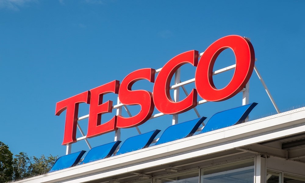 photo of a Tesco sign on a store roof