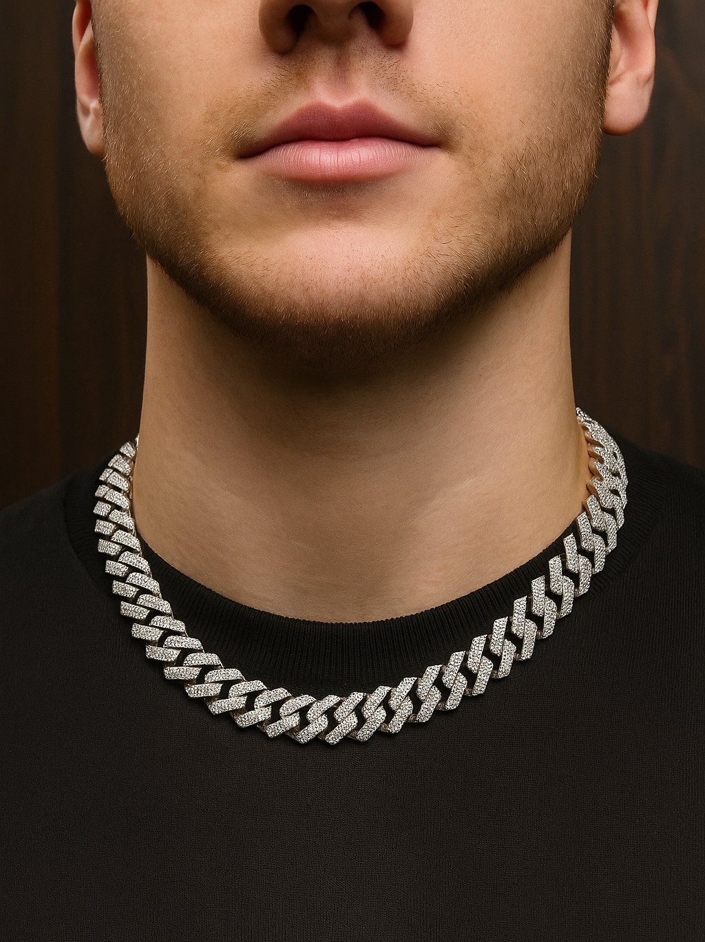 Luxury Cuban link necklace with round-cut diamonds on a black shirt.