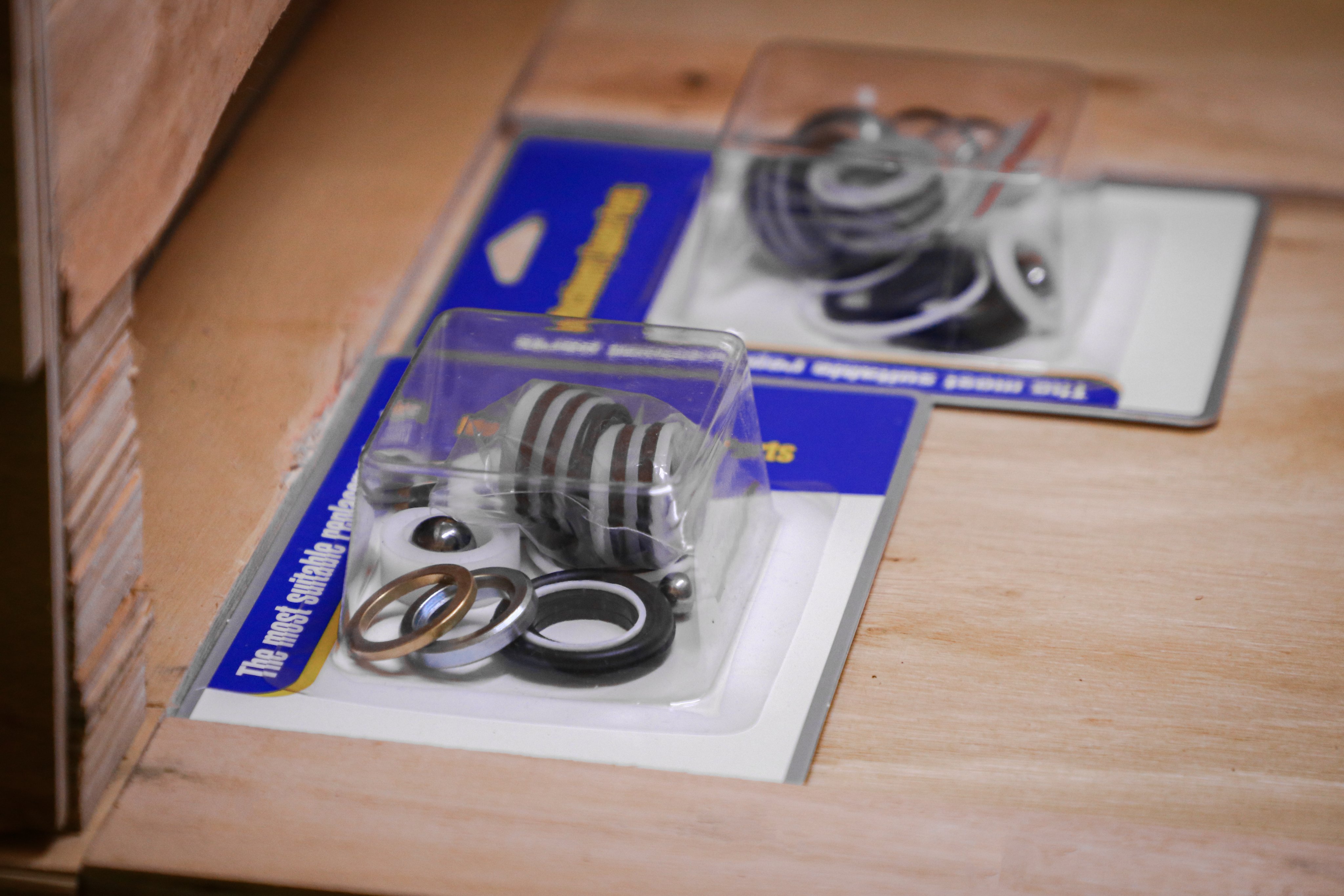 A grid of HVBAN airless sprayer spare parts and pump repair kits compatible with Graco 390, 395, 495, and 595 models, representing comprehensive OEM support and aftermarket component compatibility.