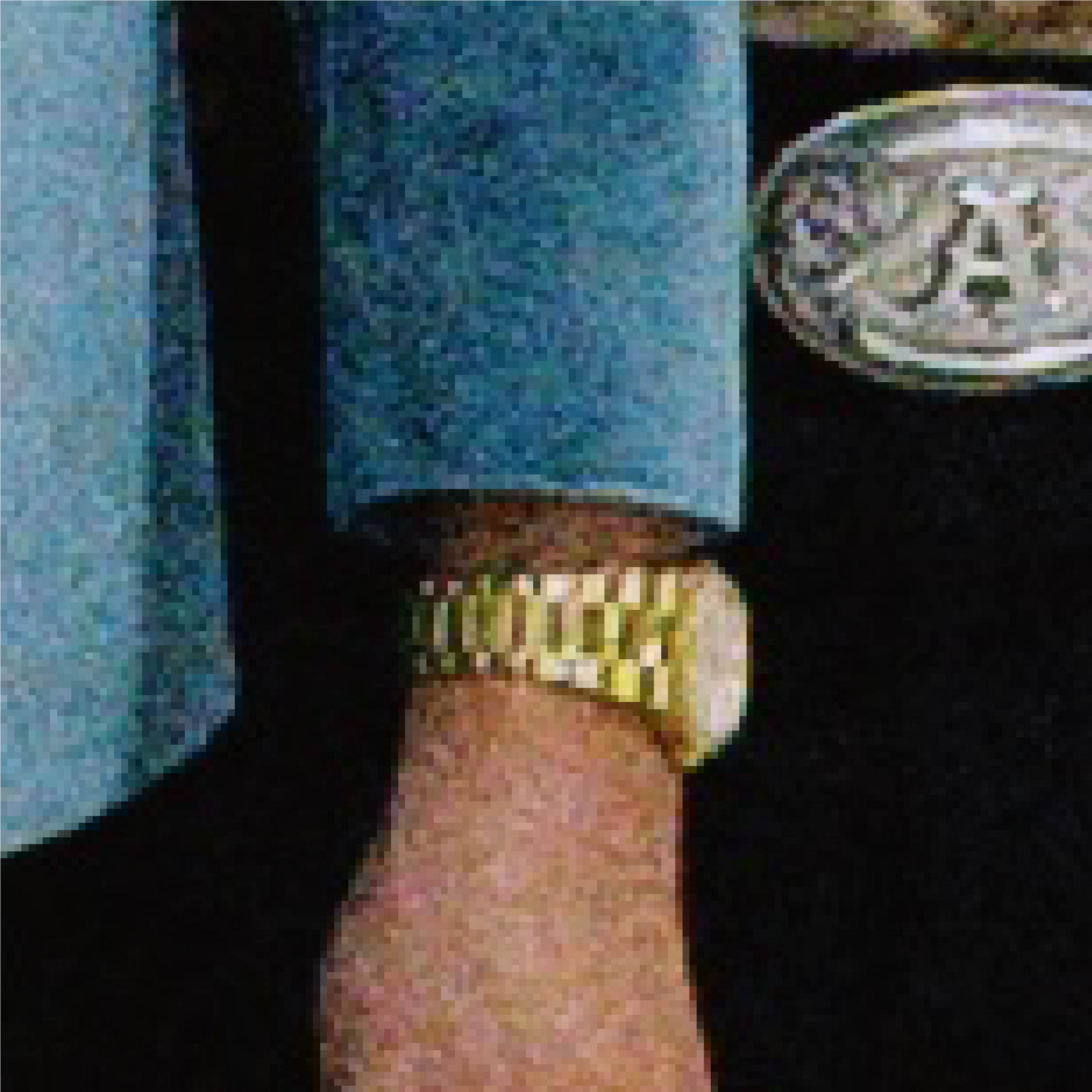 A zoomed in photo of what looks like a person wearing a gold watch and another person behind them that's wearing a silver belt buckle.