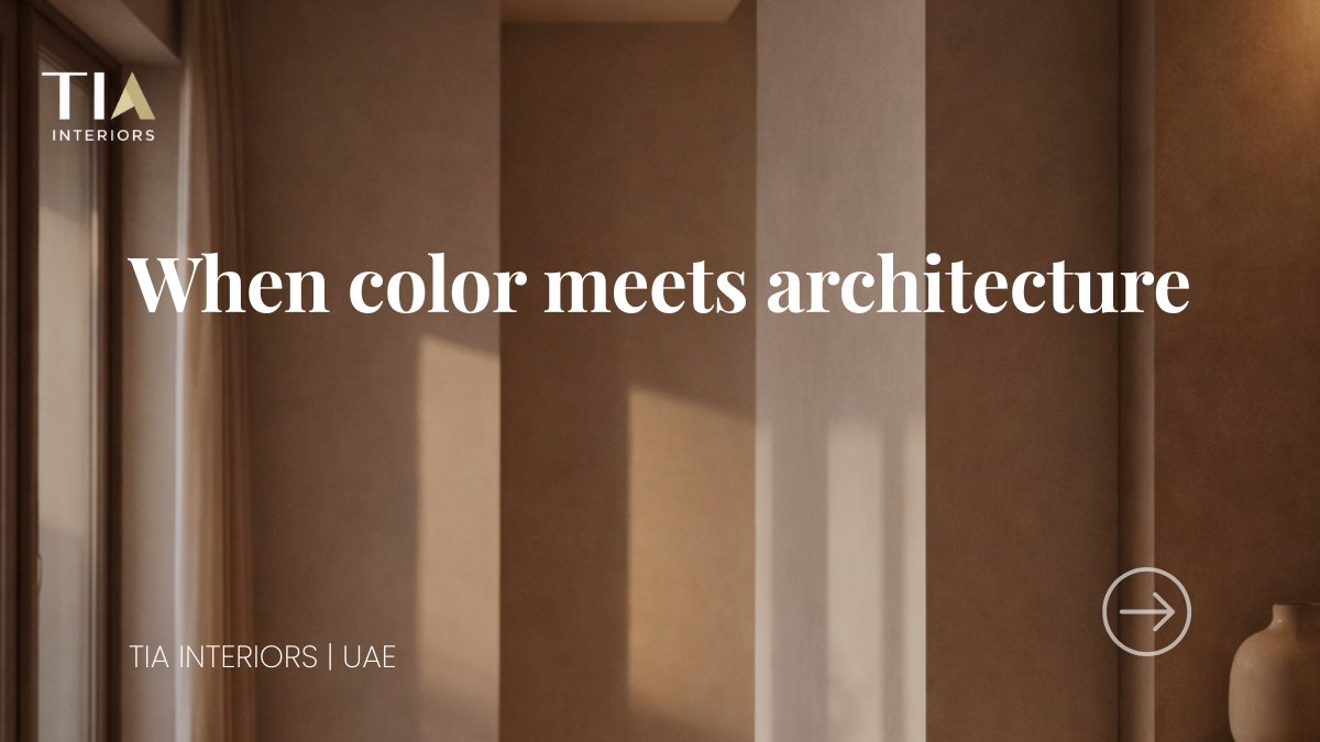 High-end interior space in warm neutral tones with light flowing across architectural walls.