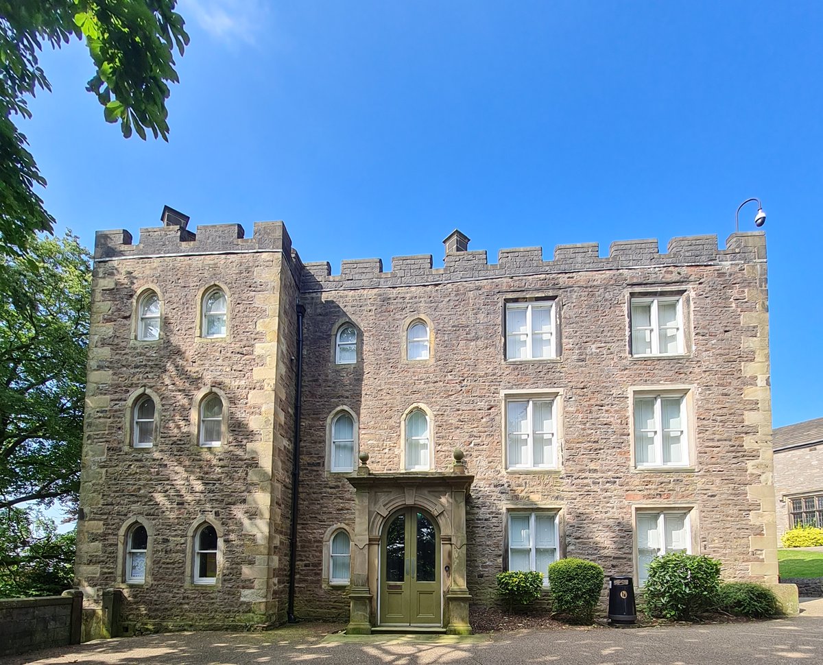 Photograph of the front of Clitheroe Castle museum on a sunny day.