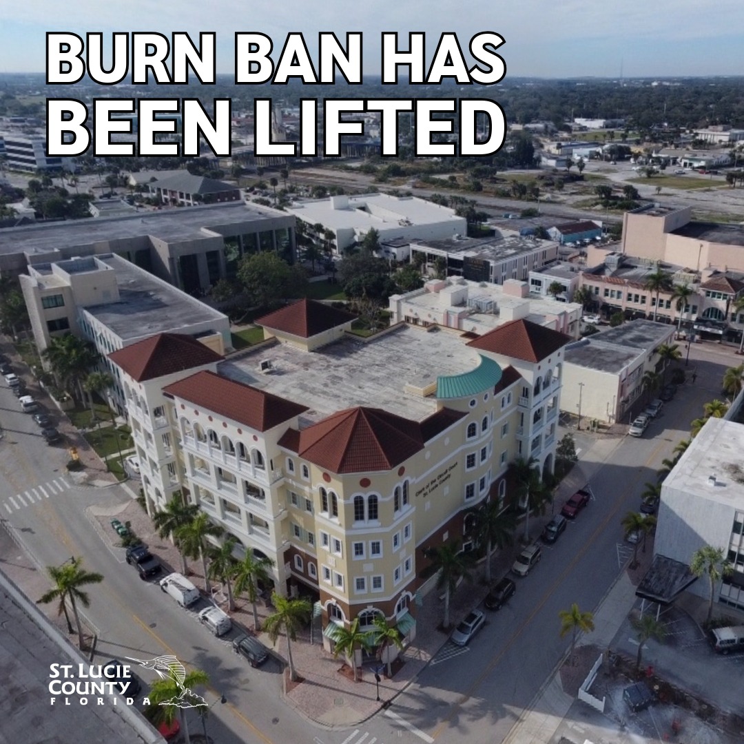 Aerial view of a sunny St. Lucie County neighborhood with text announcing the burn ban has been lifted.