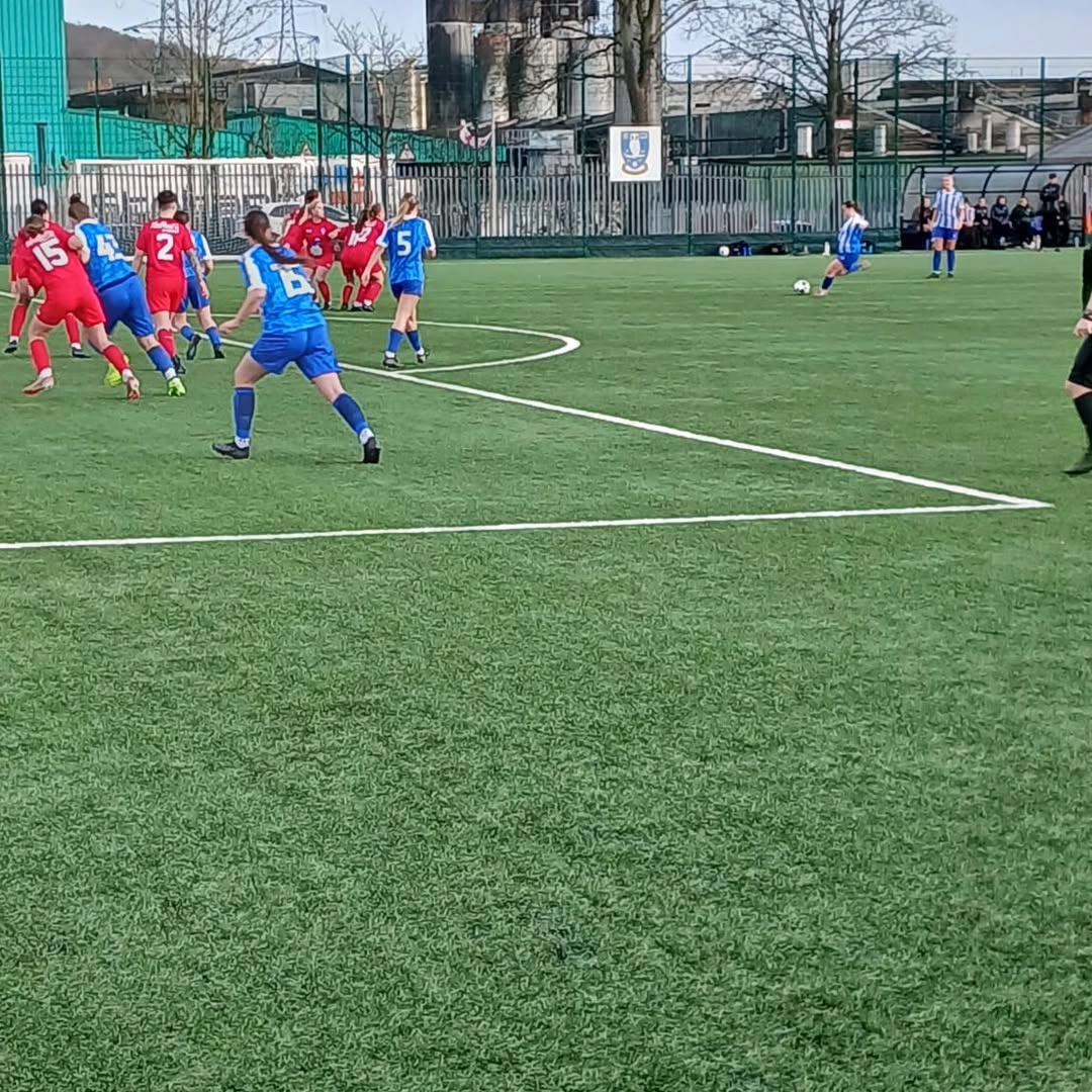 Milly Colford strikes her free-kick.