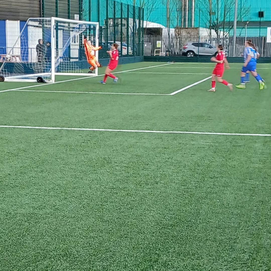 Milly Colford's free-kick beating the goalkeeper.