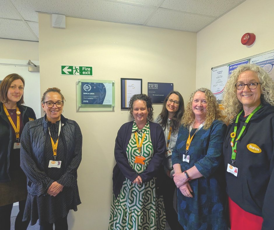 Barca-Leeds Senior Management Team stood next to the newly added plaque celebrating 25 years of Investors In People accreditation.