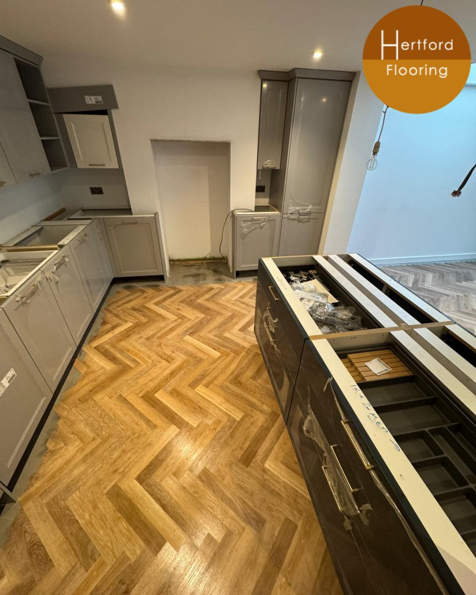 Laying the exquisite herringbone pattern down...