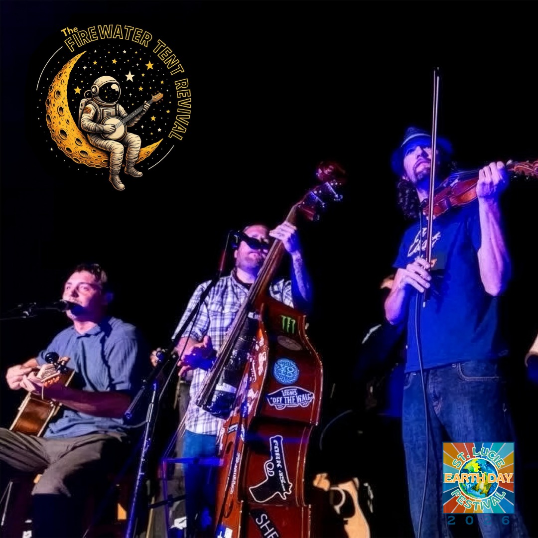 Three musicians perform on stage at night, featuring a guitarist, upright bassist with stickers, and a violinist under blue and purple lighting.