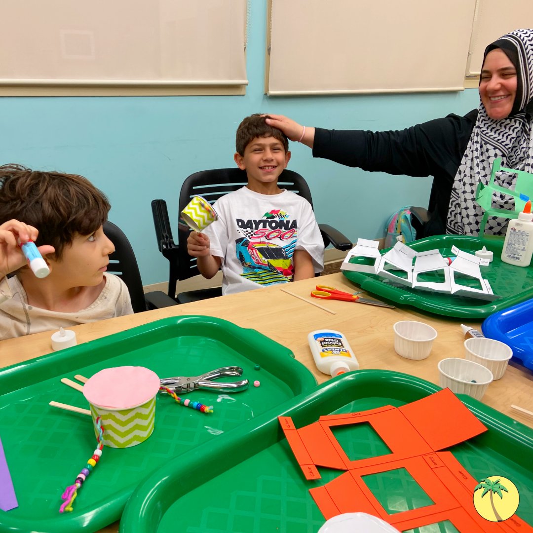 A mother and her sons crafting drums and lanterns.