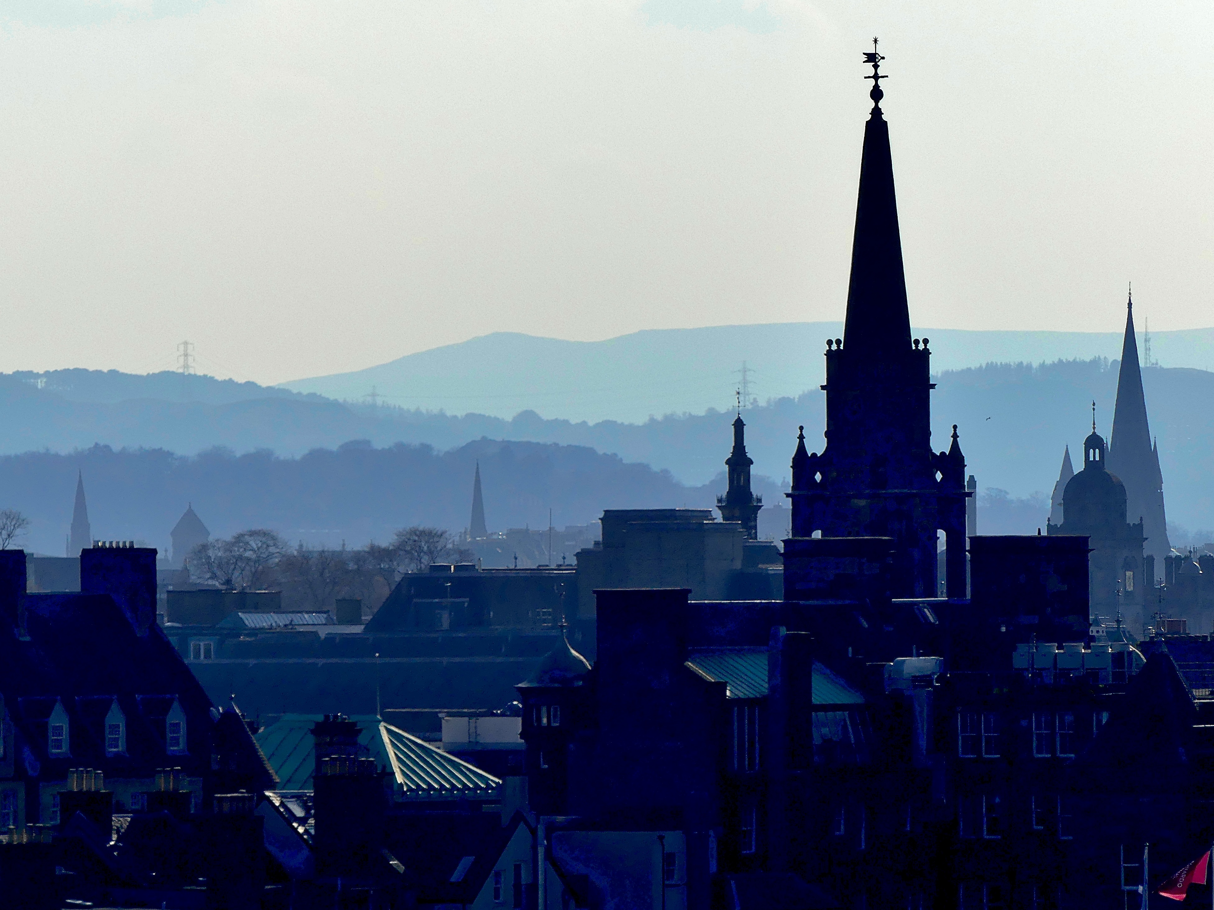Spires, towers and steeples with Braid and Pentland Hills in the background.