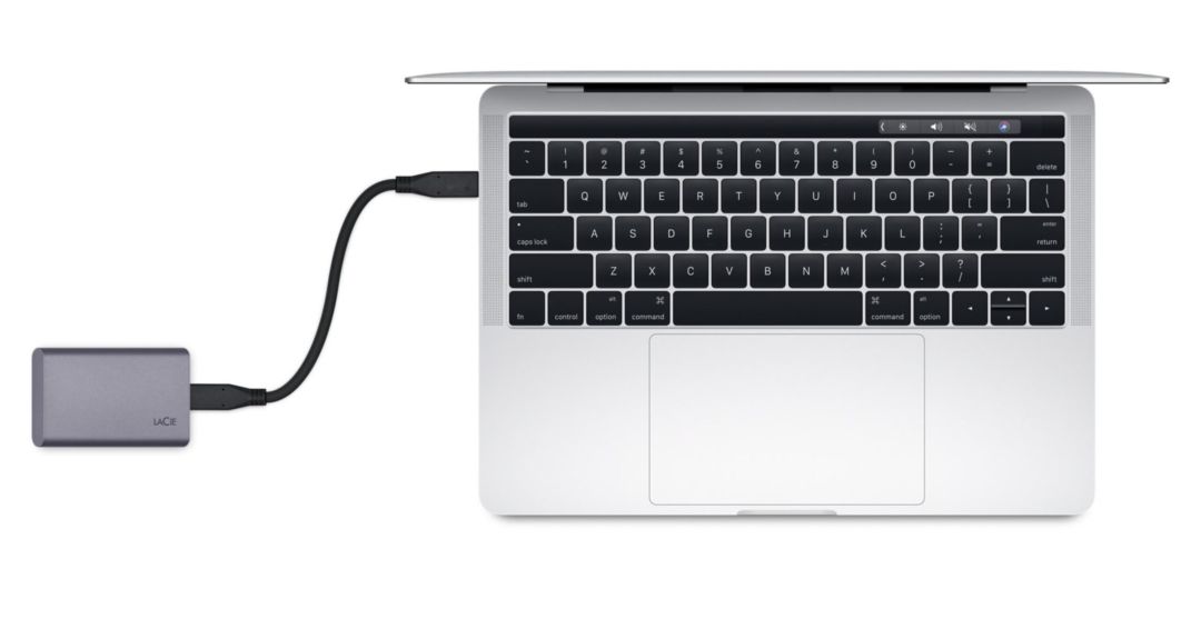 Close-up of an external solid-state drive with a blurred background, symbolizing data storage.