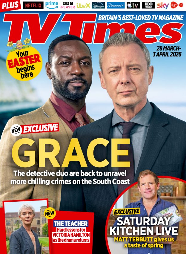 The cover of TV Times Magazine for the week of 28 March - 3 April 2026. The banner at the top reads "PLUS: Netflix, Prime Video, BBC iPlayer, ITVX, Disney+, Paramount+, Apple TV, HBO Max, Sky, Virgin Media".
There is a yellow circle under the masthead with the caption: "Your Easter begins here" and eggs and flowers above it.
The main image shows Richie Campell as Branson and John Simm as Grace in Grace with the caption: "NEW EXCLUSIVE - GRACE: The detective duo are back to unravel more chilling crimes on the South Coast."
There are two images underneath. On the left is Victoria Hamilton as Helen Simpson in The Teacher with the caption: "NEW THE TEACHER - Hard lessons for VICTORIA HAMILTON as the drama returns." On the right is Matt Tebbutt with the caption: "EXCLUSIVE - SATURDAY KITCHEN LIVE: MATT TEBBUTT gives us a taste of spring."