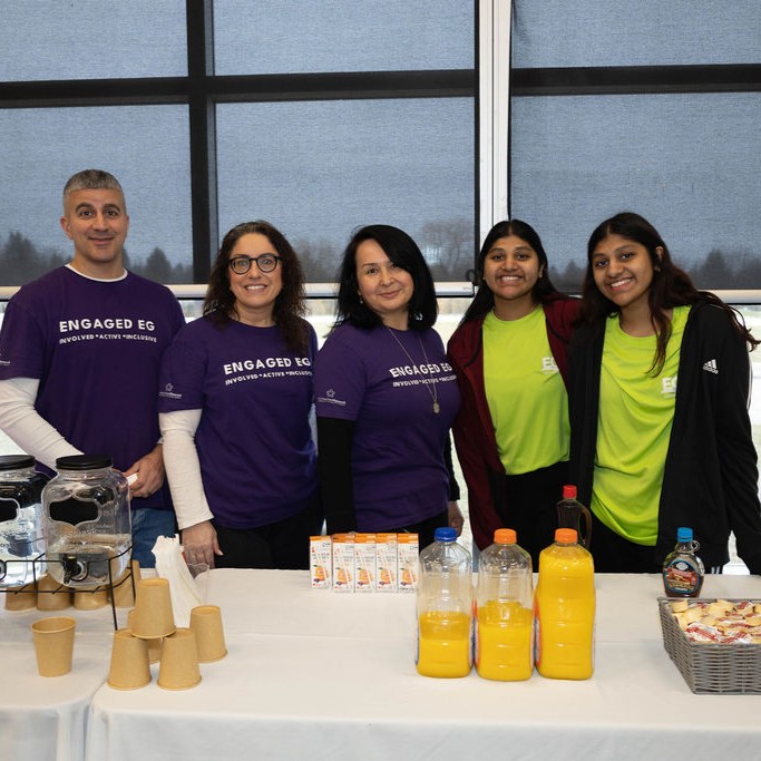 Various Engaged EG volunteers smiling into the camera.