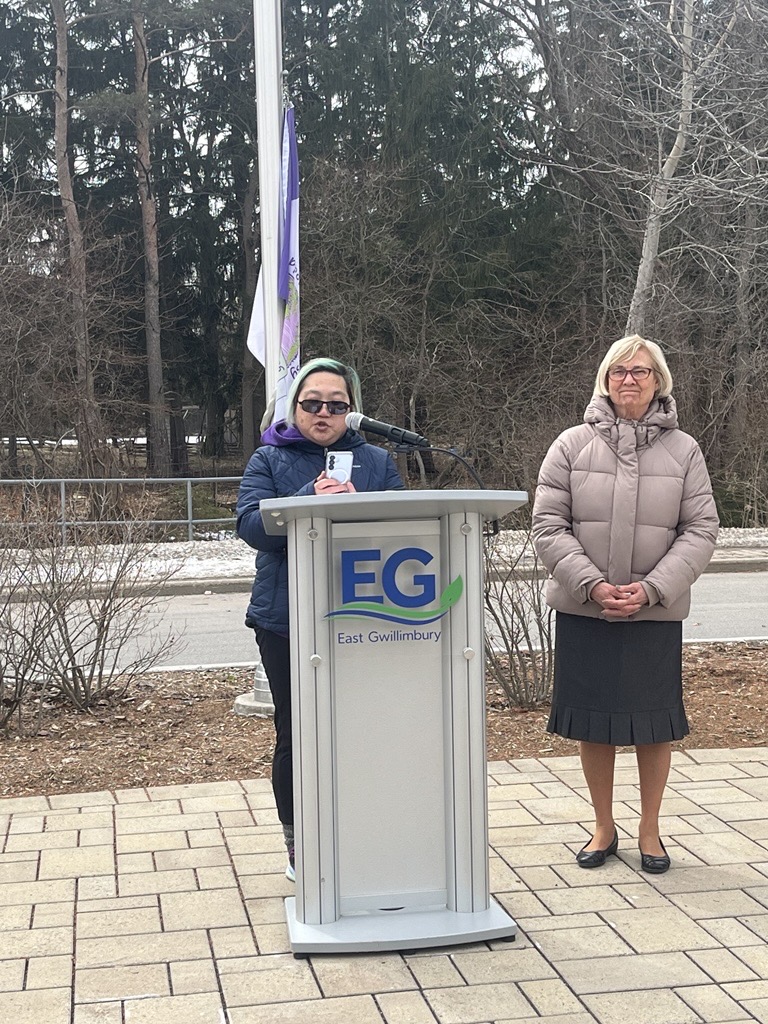 Representative from Epilepsy York Region and Mayor Virginia Hackson outside at a podium speaking. 