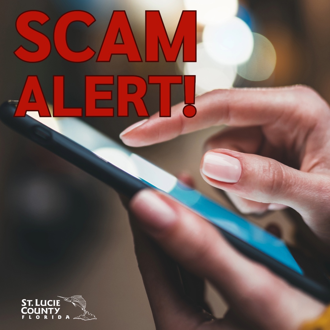 Close-up of a hand holding a smartphone with a bold red 'SCAM ALERT!' warning overlayed on the image.