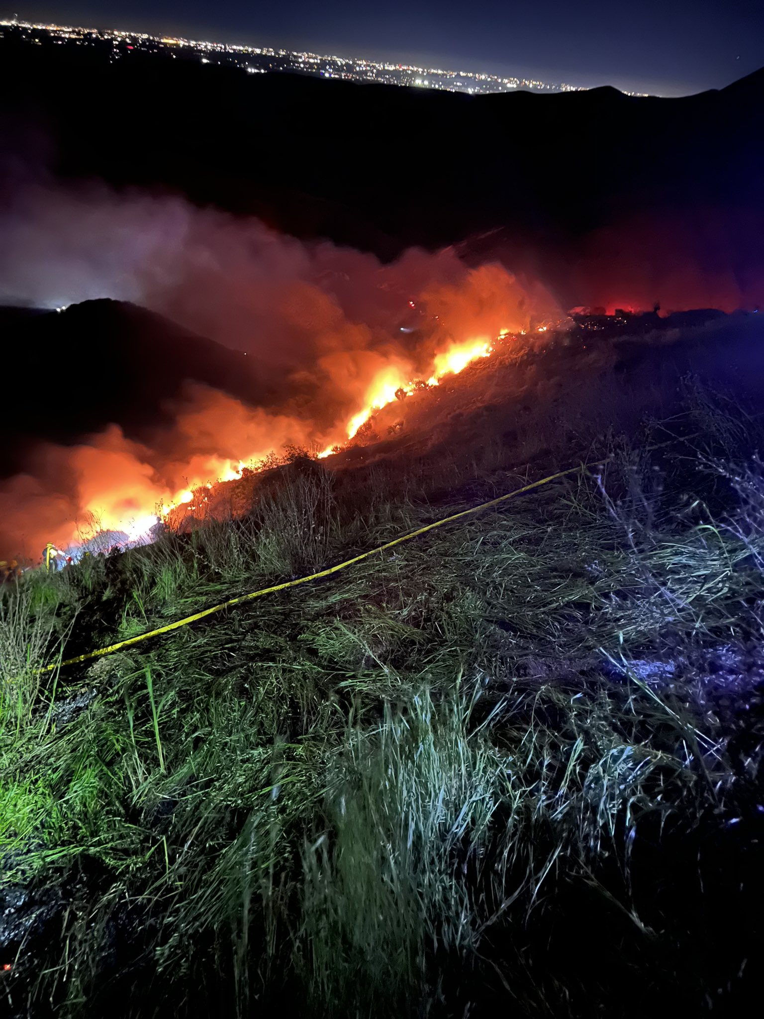 Flames from the vegetation fire, a picture from the side of the hill