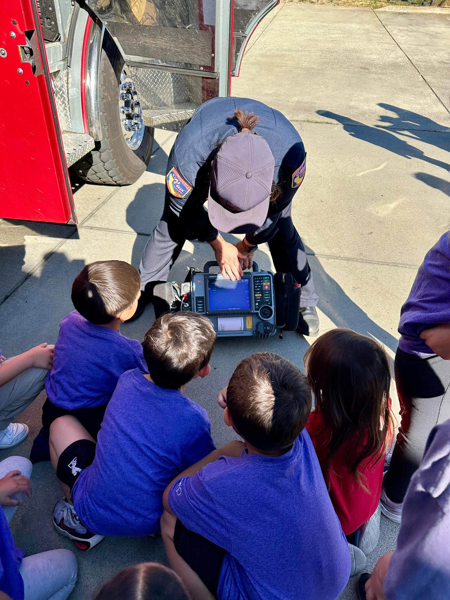 A CAL FIRE engineer paramedic showing their cardiac monitor
