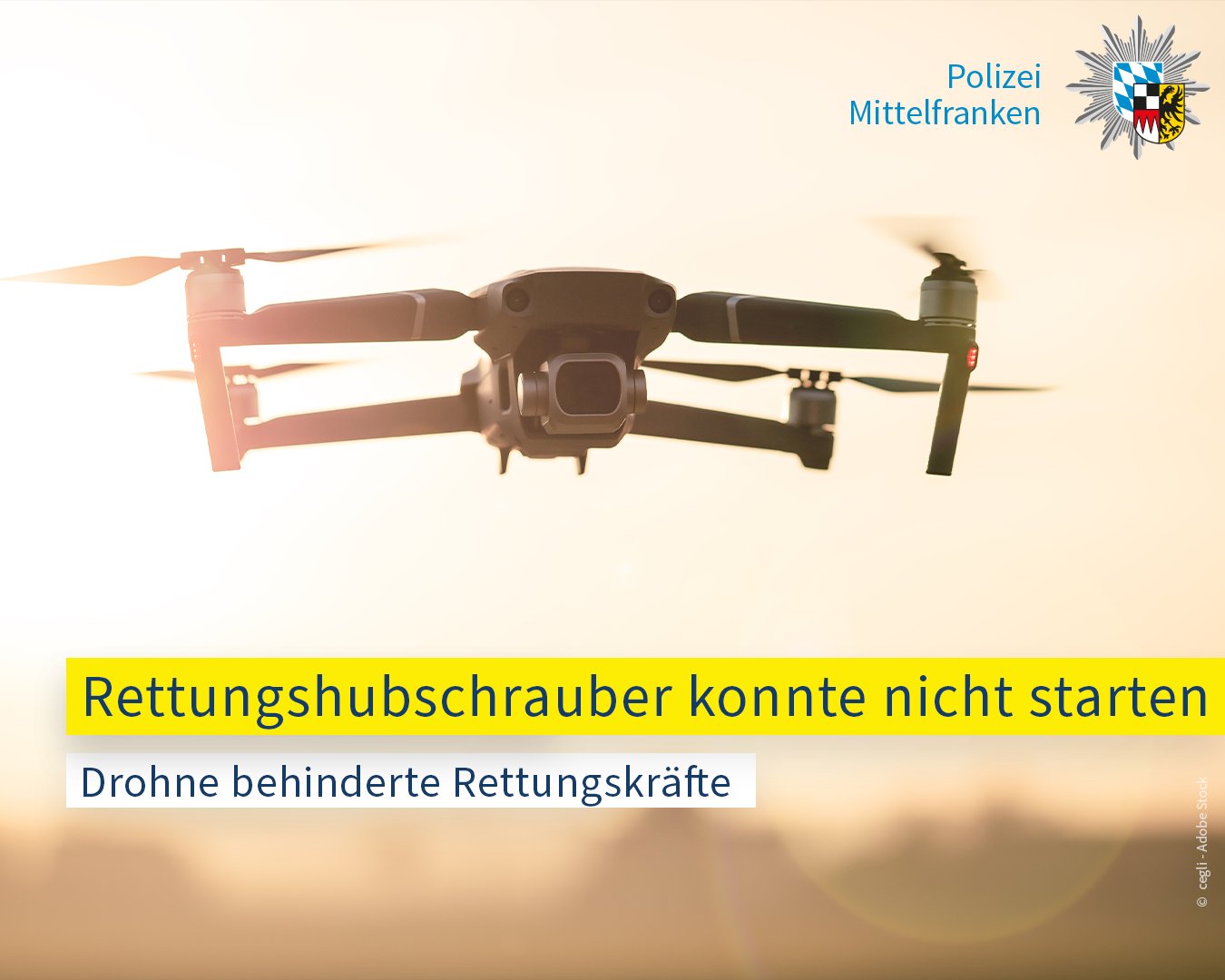 Auf dem Bild ist eine Drohne zu sehen. Auf dem Textbanner steht: Rettungshubschrauber konnte nicht starten - Drohne behinderte Rettungskräfte. 