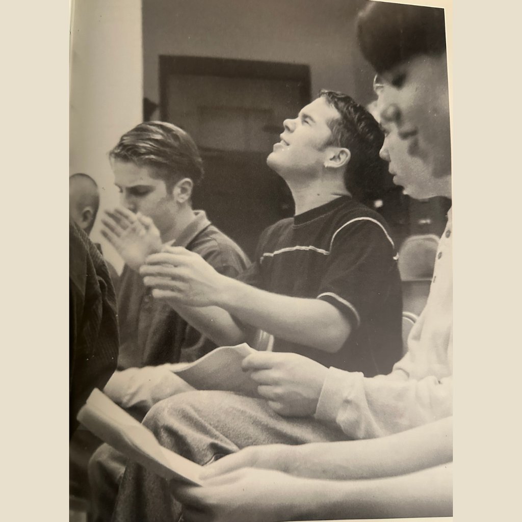 Teenage boy singing his heart out in choir class.